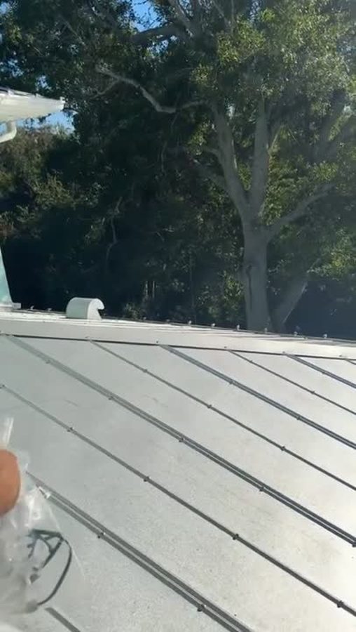 Close-up of roofline clips being installed