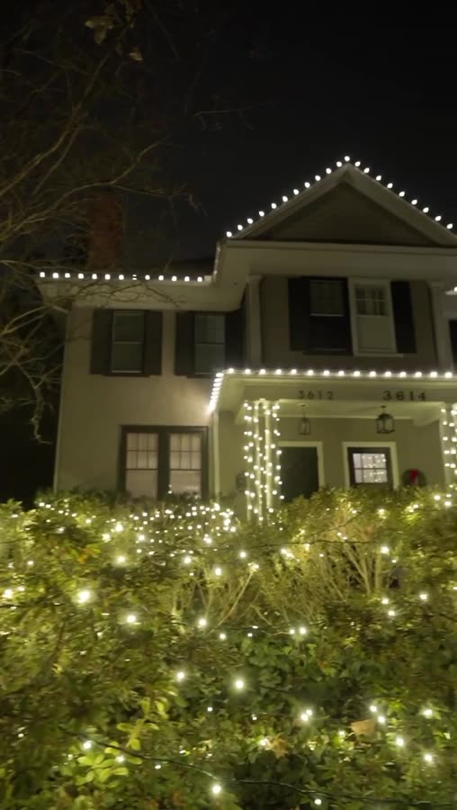 Traditional home with roofline lighting and wrapped entry columns